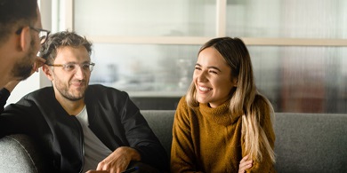 Male and female smiling during the meeing in the conference room