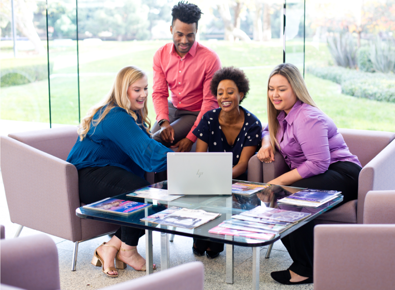 AAA employees Alyssa, Jamil, Patrice and Sarahi working together.