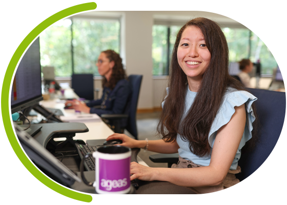 Woman using laptop smiling