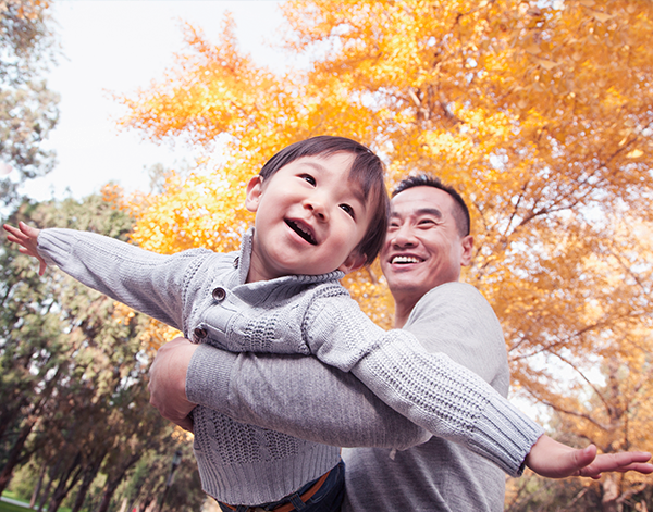 Employee spends time outdoors with their child.