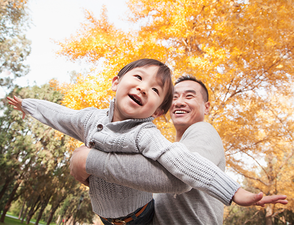 Employee spends time outdoors with their child.