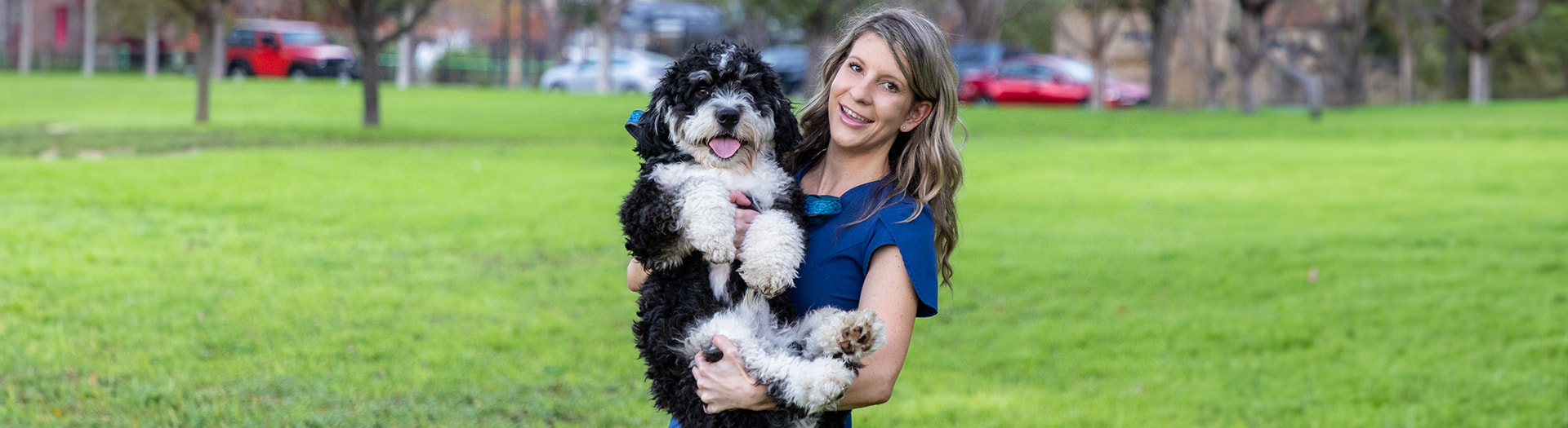 Page Header Image - PRN and Float Program - Nurse holding her dog in a park