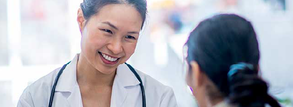 Tile - Providers - Physician consulting a new mother and baby
