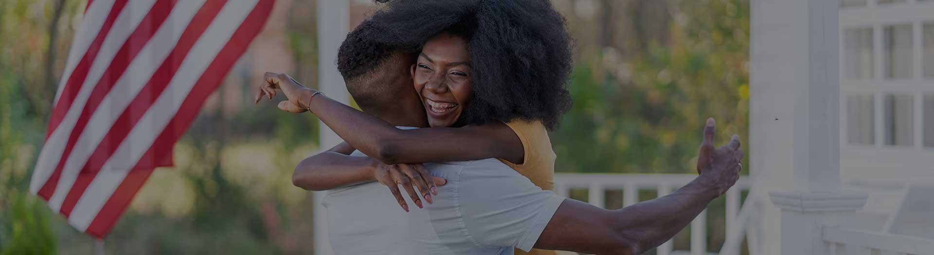 Page Header Image - Ascension Careers, Military & Veterans - African America couple embracing near US flag