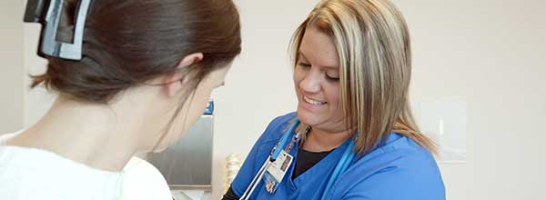Tile - Ascension Medical Group - How We Hire - Nurse checking female patient's blood pressure