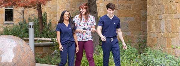 Tile - Ascension Nursing - Benefits and Perks - Three nurses walking outside hospital