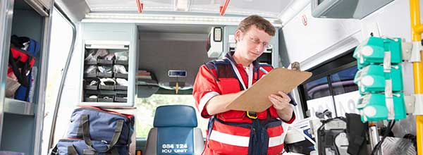 Tile - Ascension Emergency Services - EMT taking inventory in ambulance