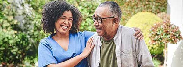 Tile - Ascension Living - How We Hire - Nurse comforting elderly man outdoors