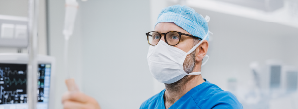 Tile - Providers - Nurse anesthetist checking an IV
