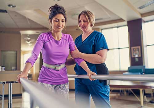 Tile - Rehabilitation - Nurse assisting patient on parallel bars