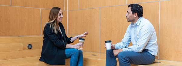 Tile - Technology Data Science Institute - Man and woman having a discussion over coffee