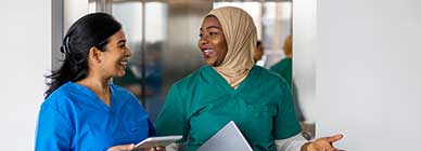 Tile - Ascension Allied Health Jobs - Two female medical professionals walking and chatting