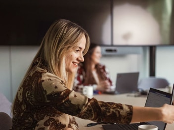 Woman sitting on desktop