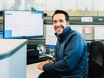 Happy colleague smiling at the camera