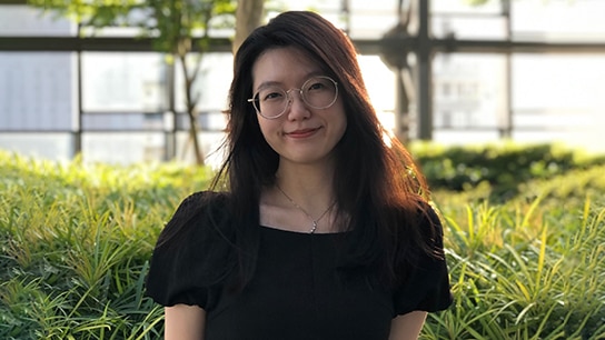 Liew Yan Yu smiling as she looks into the camera