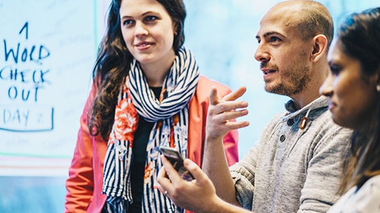 Colleagues talking to each other