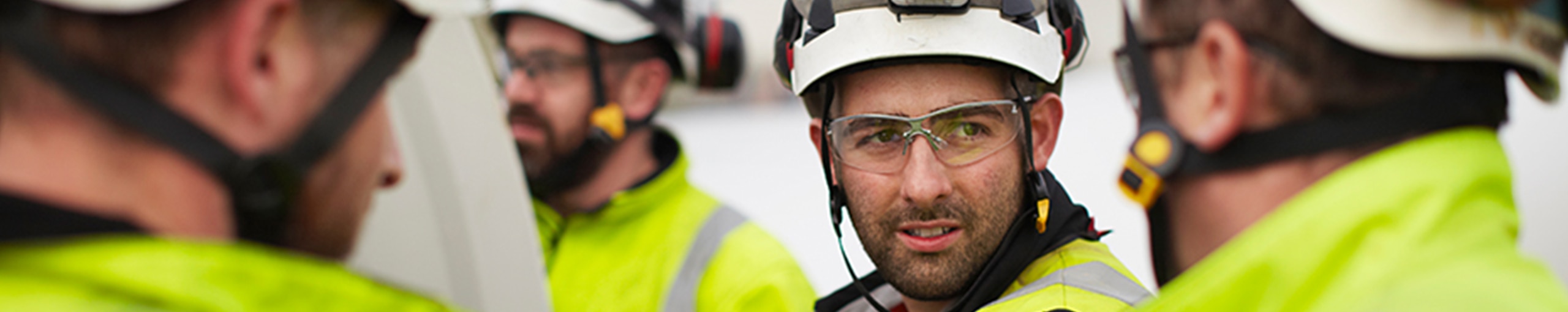 A group of engineers wearing hard hats