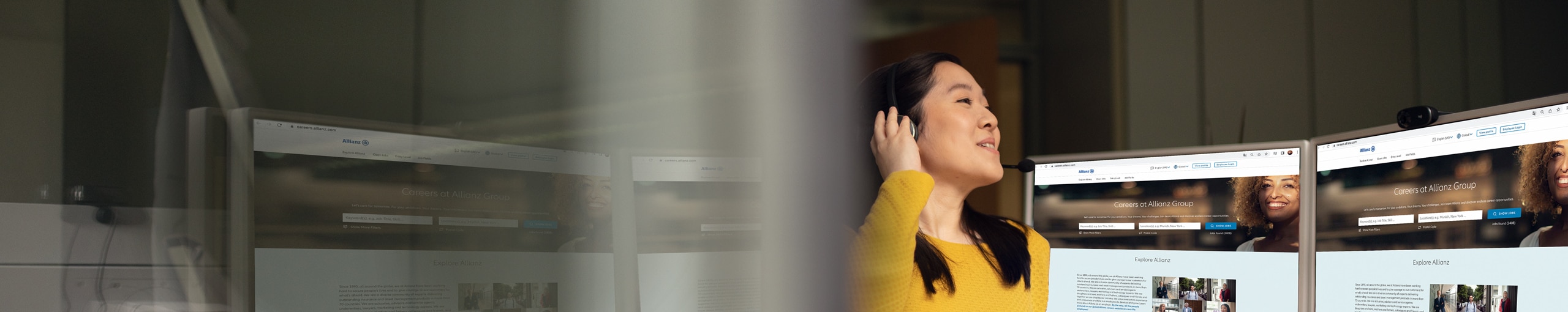 Happy employee wearing a headset working on a laptop