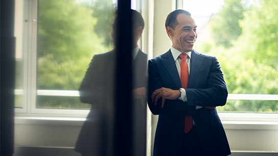Allianz employee with cheerful expression