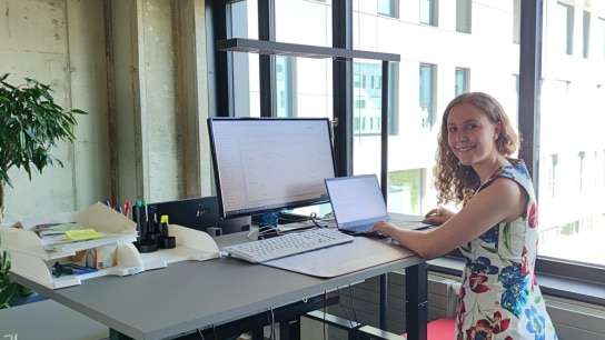 Johanna working on a laptop