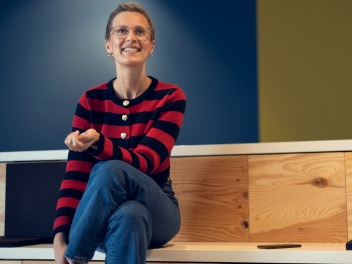 Happy Allianz employee looking forward
