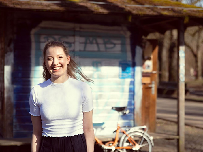 Smiling colleague looking at the camera in a casual setting
