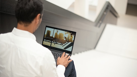 Close shot of an employee working on a laptop
