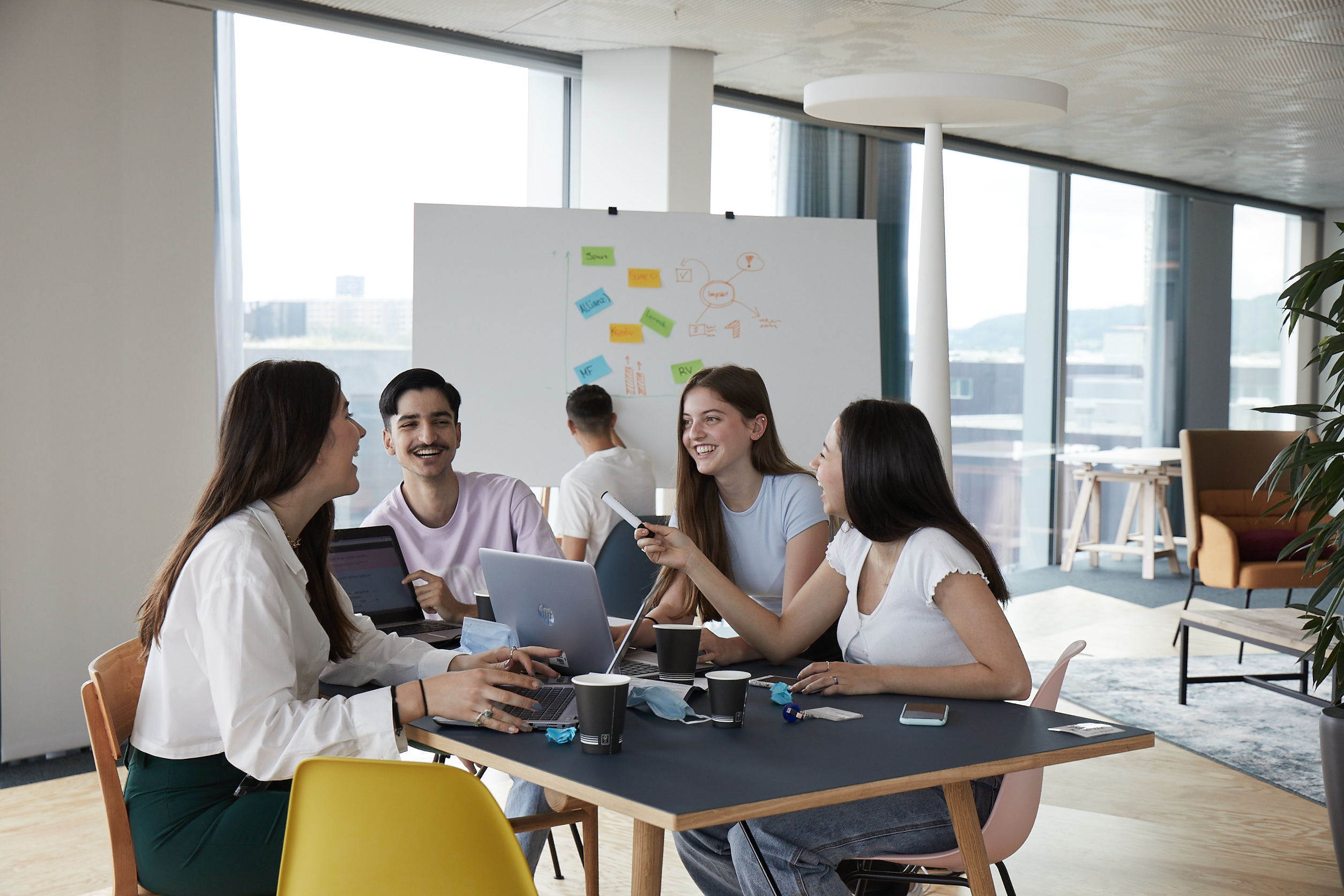 Students sitting together at a table and talking