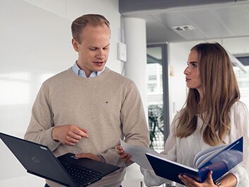 Colleagues discussing some files