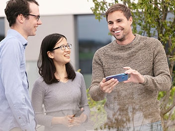 Employees in a joyful conversation
