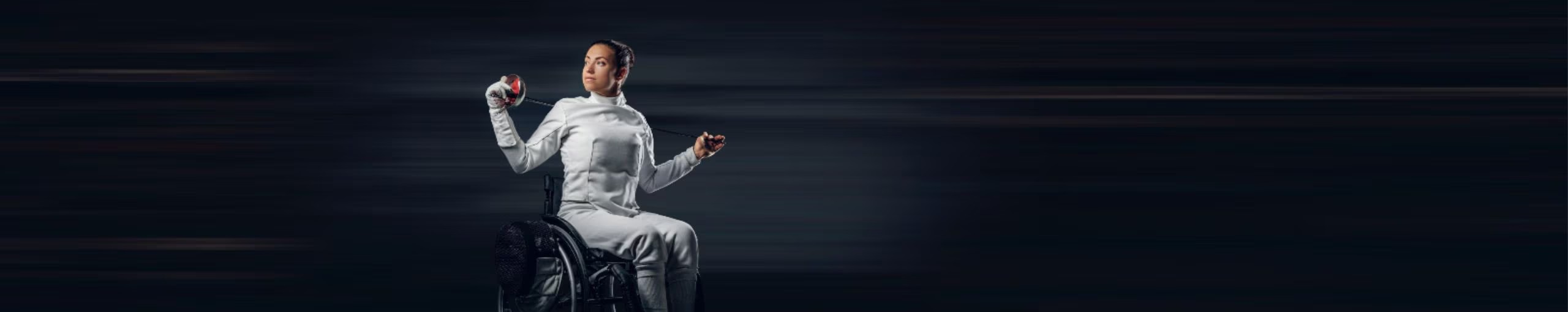 A woman in a wheelchair is seated comfortably on a chair, showcasing her strength and resilience