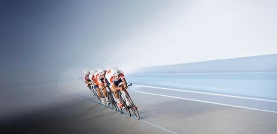 A dynamic scene of cyclists racing on a track