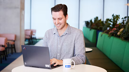 Chris working on his alaptop