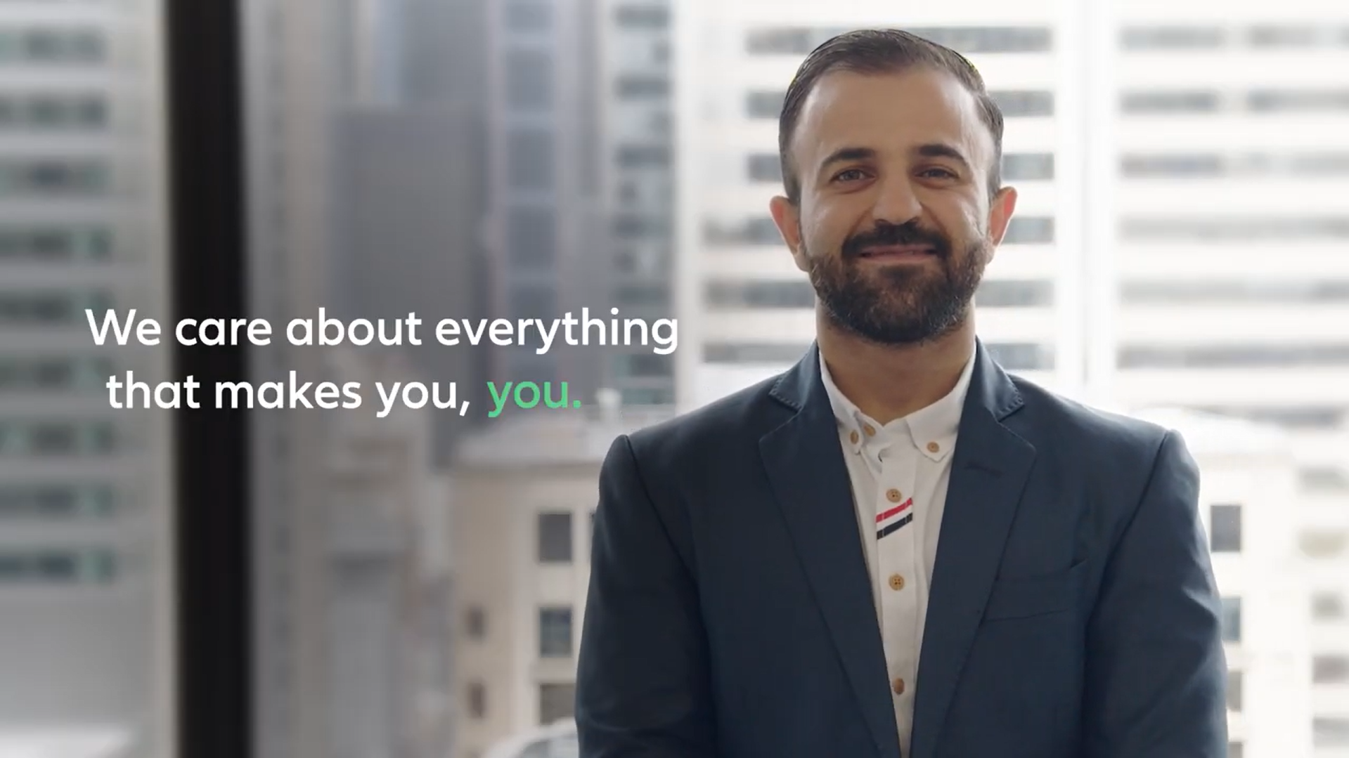 Head shot of Sinan with text "We care about everything that makes you, you."