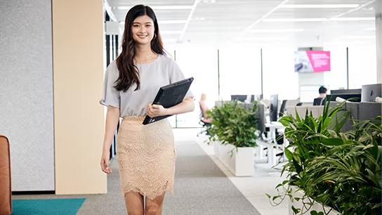 Fiona strides through a sleek office building