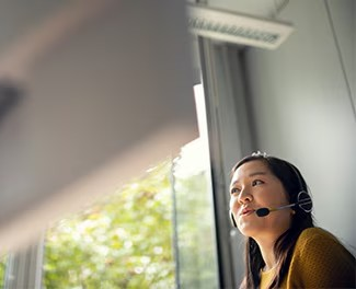 An employee wearing a headset