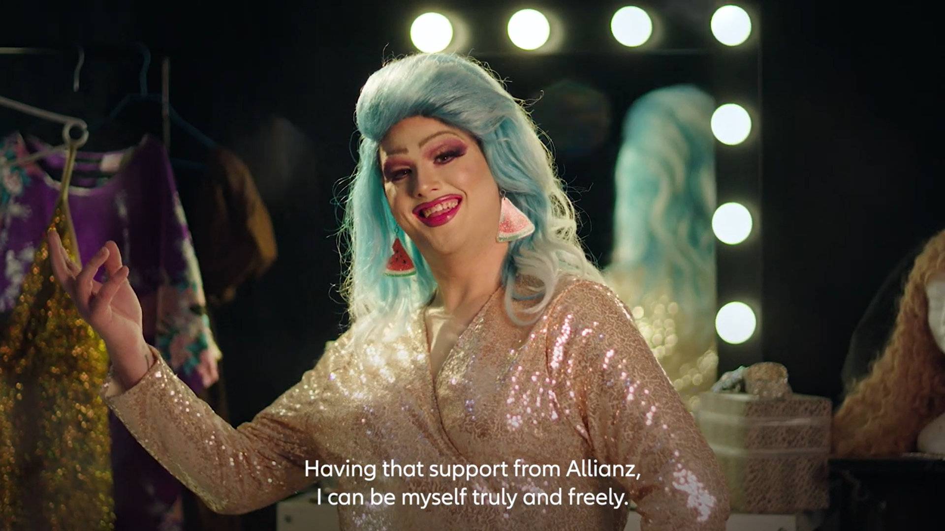 Patrick as Walter melon, a woman with striking blue hair elegantly wears a shimmering gold dress, exuding confidence and style