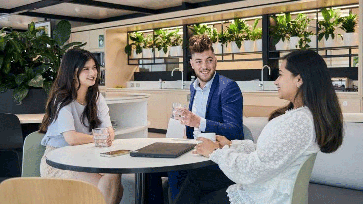 Colleagues in a joyful conversation