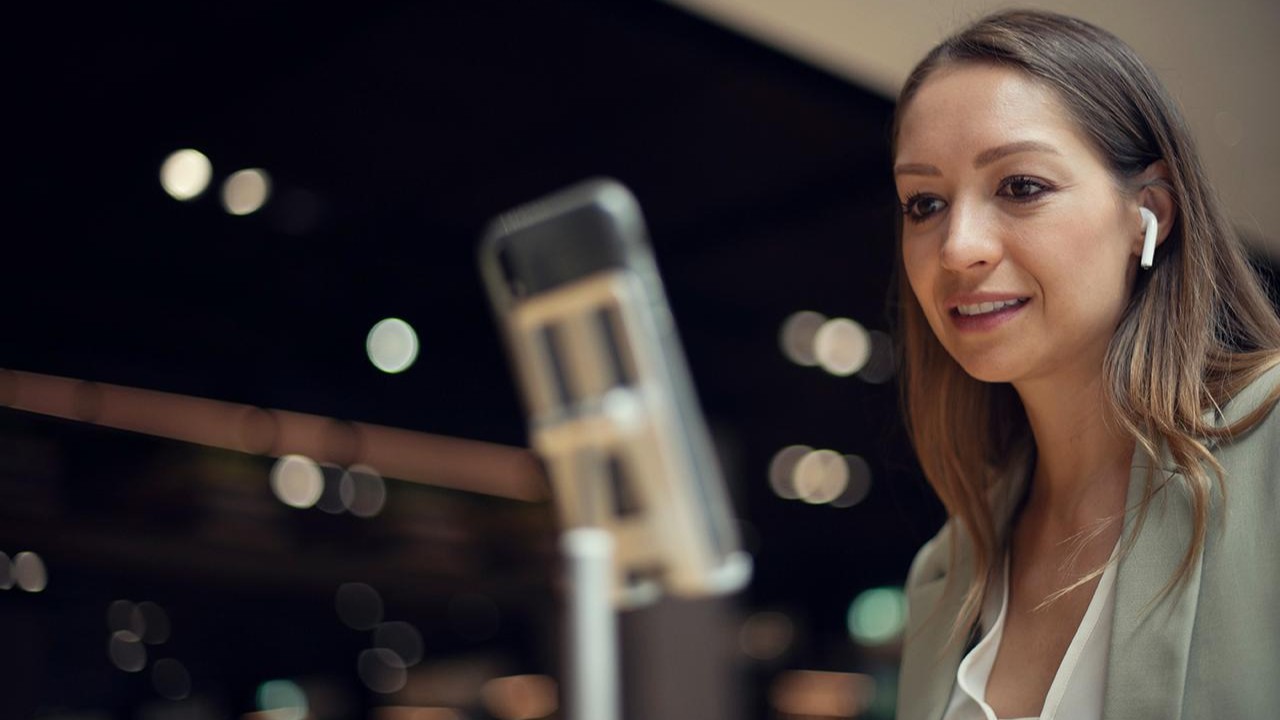 Woman with airpods videocalling on phone