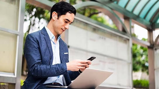 Employee scrolling through his phone