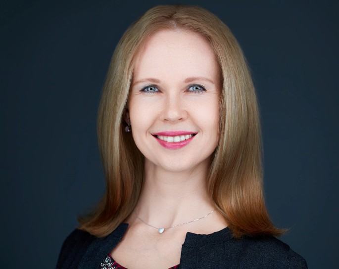 Woman in front of black background 