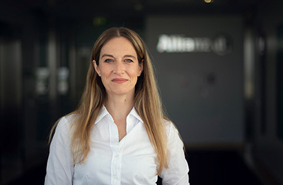 Smiling and confident Allianz employee, camera-facing