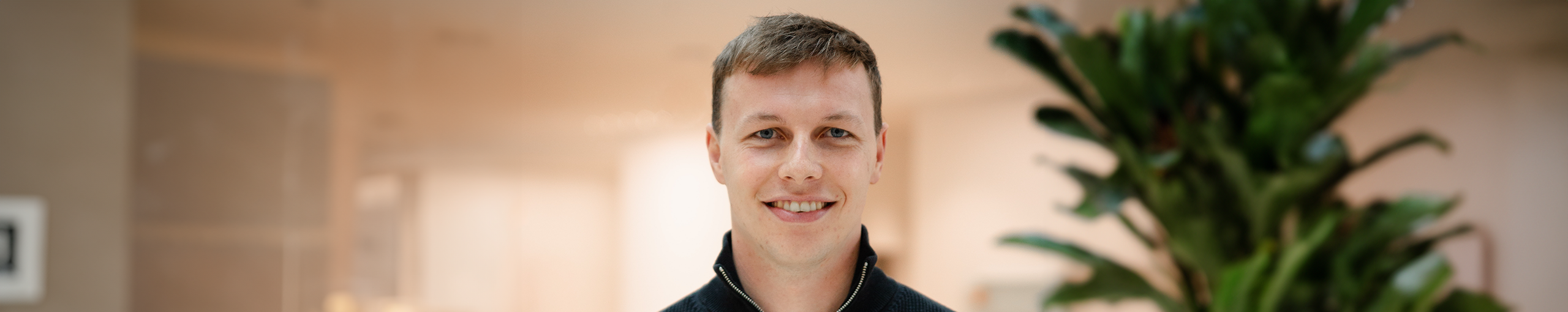 Oliver from Allianz SE smiling at the camera