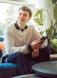 Colleague holding phone and smiling