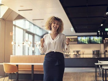 happy woman in a modern office environment