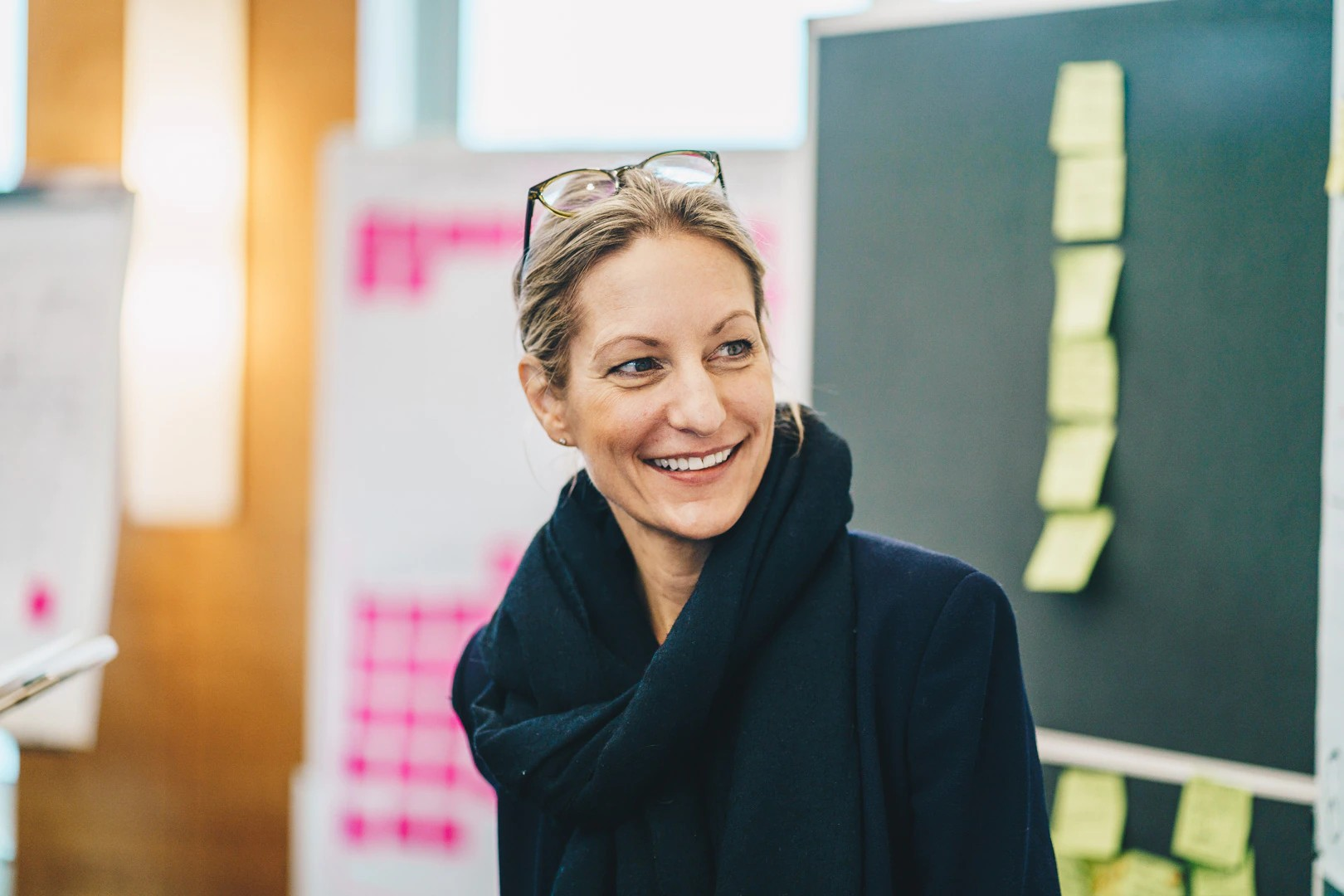 Happy looking woman with glasses on top of head