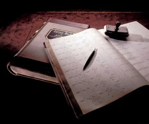 Old photo of a register book with pen and seal