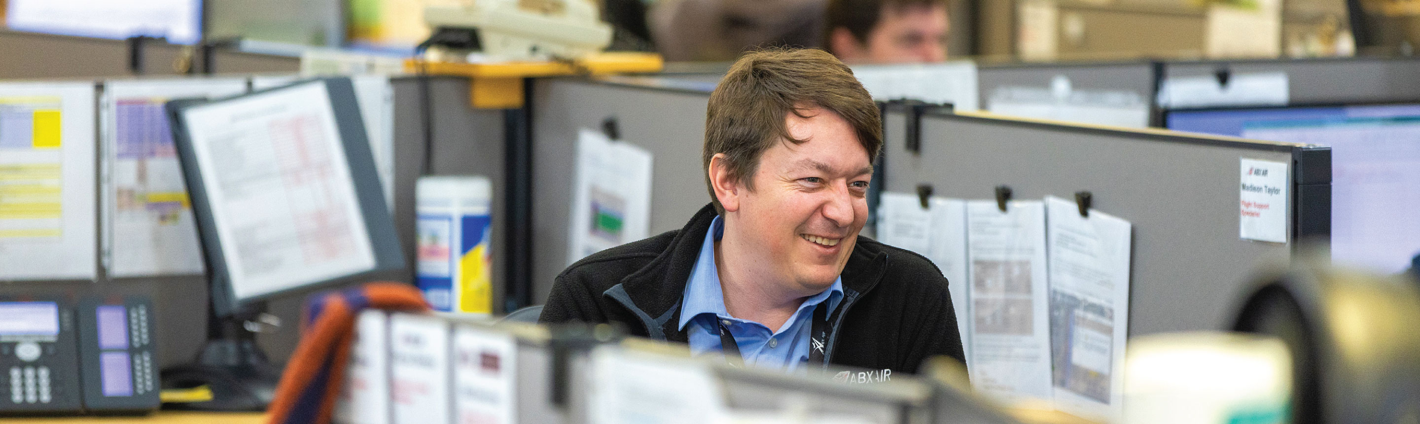 Phenom-Header-Smiling-Employee