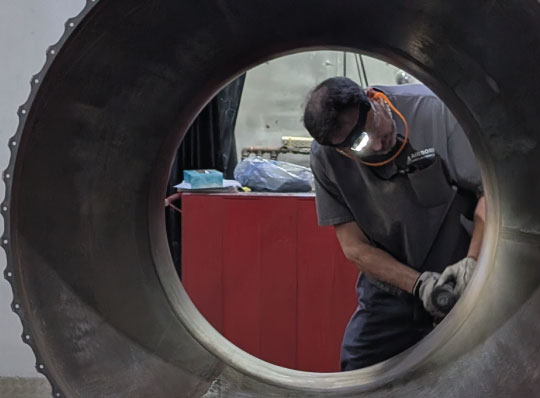 aviation maintenance technician working on aircraft part