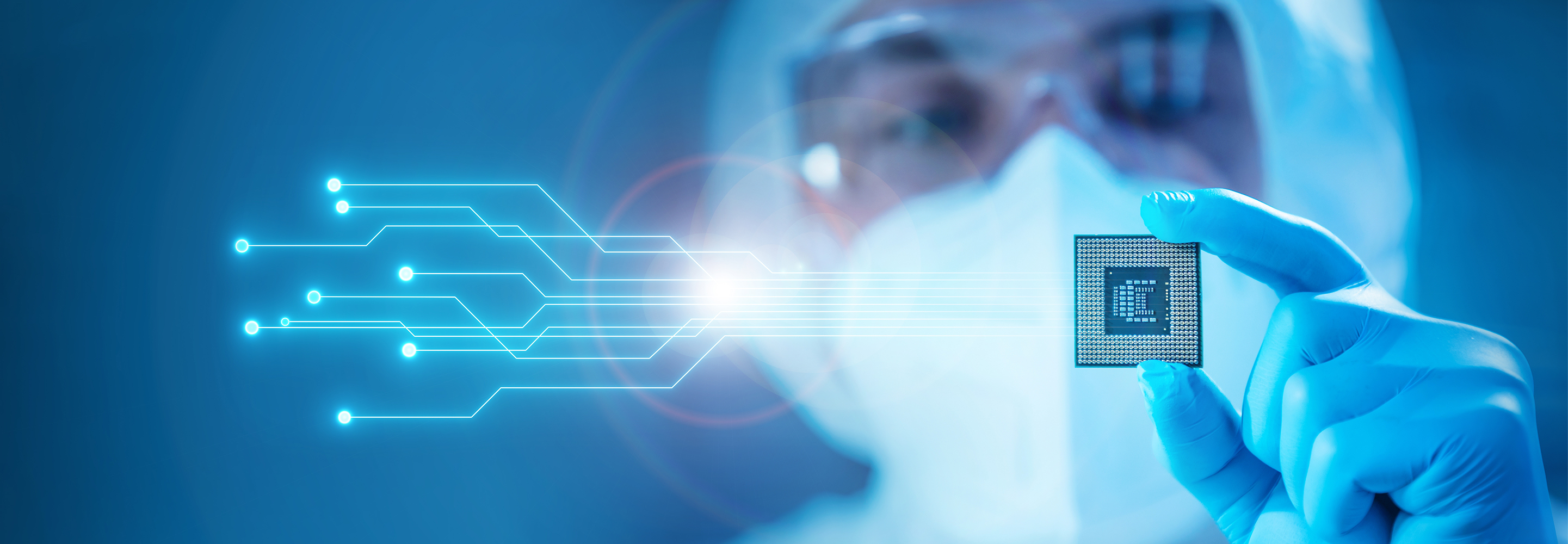 A scientist holding a microchip.